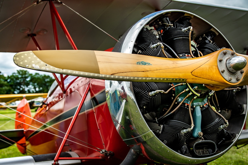 close-up, spoke, mode of transportation, aviation, red, classic, metal, retro, airshow, focus on foreground, yellow, wheel, absence, vintage, engine, rope