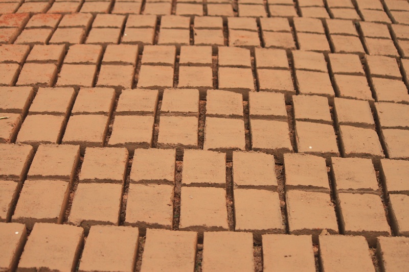 building, paving stone, 2K, no people, full frame, nature, arrangement, shape, design, outdoors, sunlight, high angle view, banyumas, red, brown, in a row