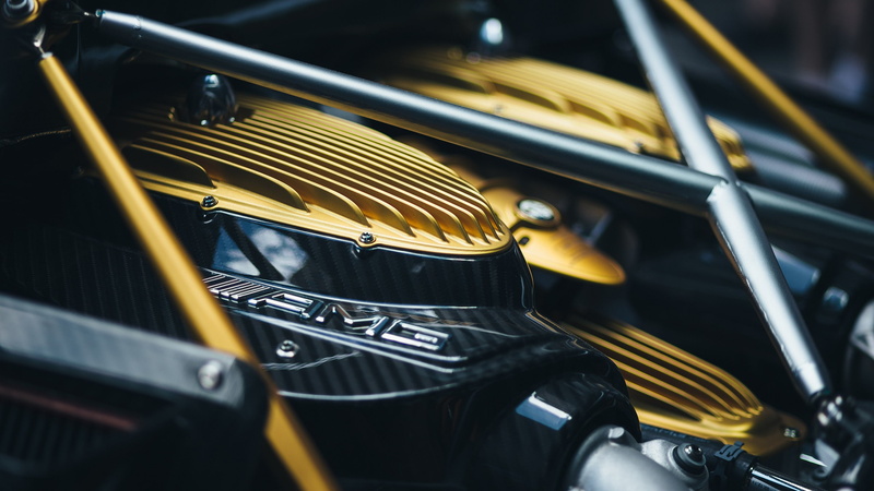yellow, mode of transportation, headlight, western script, arts culture and entertainment, 2K, land vehicle, full frame, focus on foreground, Huayra, transportation