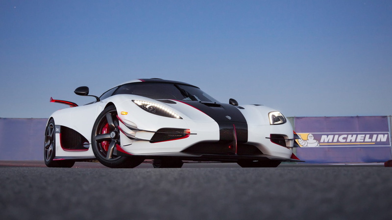 car, blue, day, mode of transportation, vehicle, air vehicle, sports, one, luxury, sport, transportation, speed, outdoors, coupe, nature, sports race, motor racing track