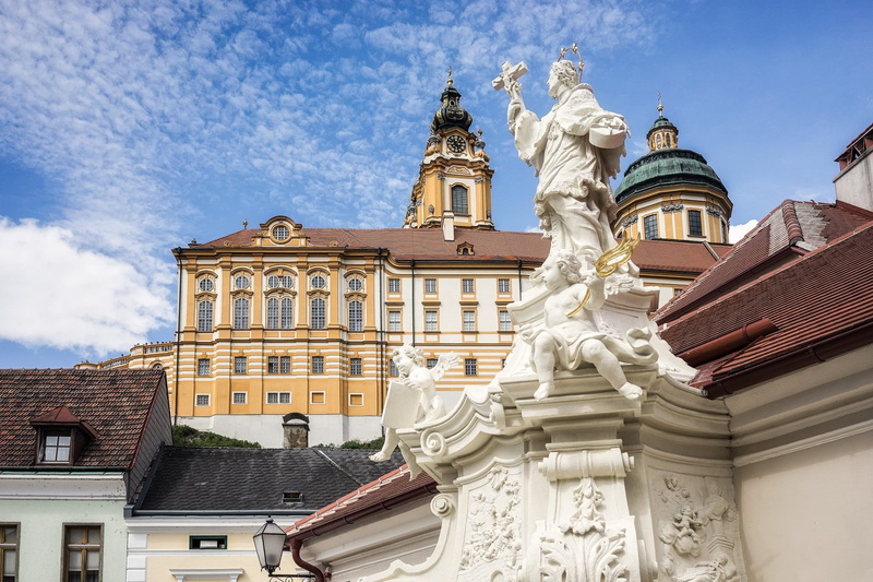 statue, sky, cut out, day, cloud - sky, low angle view, sculpture, cloister, craft, no people, architecture, nature, yellow, melk, baroque, built structure