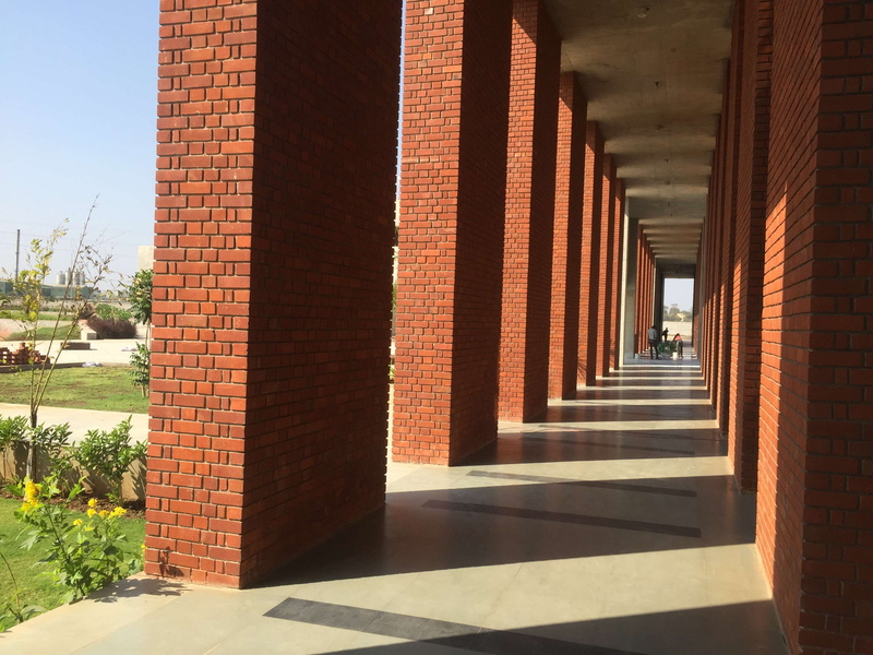 building exterior, corridor, college, arcade, university, light and shadow, brick, angle, education, red bricks, wall - building feature, direction, footpath