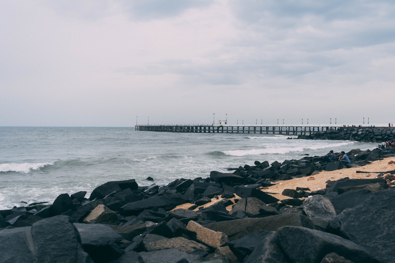 rock beach, day, outdoors, india, puducherry, nature, motion, sand, cloud - sky, tranquility, beach, solid, groyne, blue, land, black, no people, scenics - nature