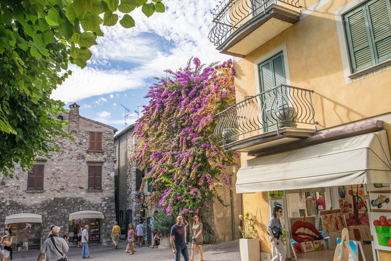 lombardy, europe, group of people, men, tree, travel, adult, italy, outdoors, plant, tourism, building, exterior, building exterior, flowers, lake garda