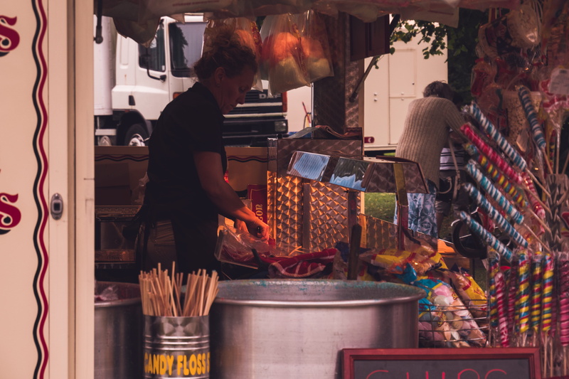 food, united kingdom, adult, sale, casual clothing, park, funfair, food stall, business, food and drink, real people, indoors, retail, variation, uk, container