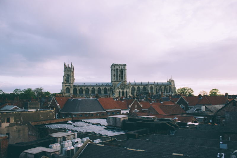building, outdoors, no people, high angle view, adventure, rooftop, town, place of worship, sky, architecture, sunset, cityscape, nature, cathedral, residential district