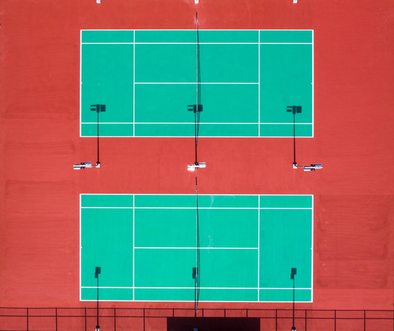 tennis, building exterior, tennis court, security, architecture, locker room, wall - building feature, aerial shot, competition, green color, no people