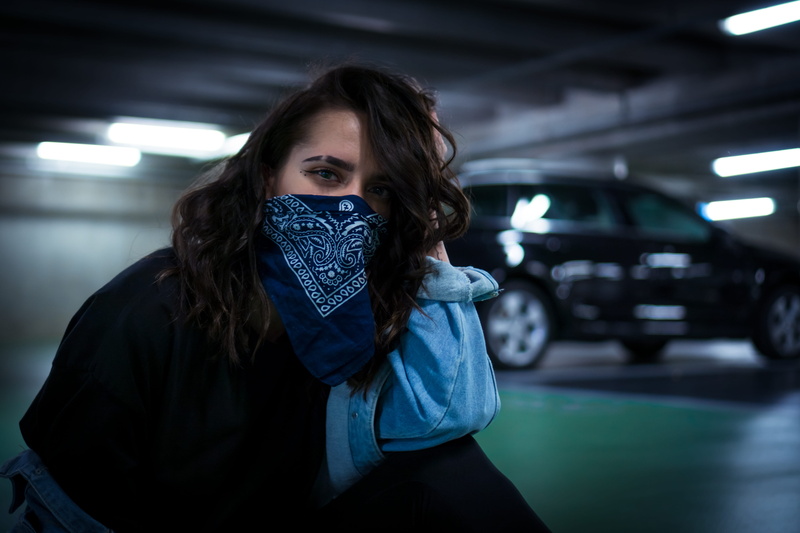 motor vehicle, standing, apparel, headband, indoors, long hair, bandanna, women, portrait, focus on foreground, machine, person, front view, young adult