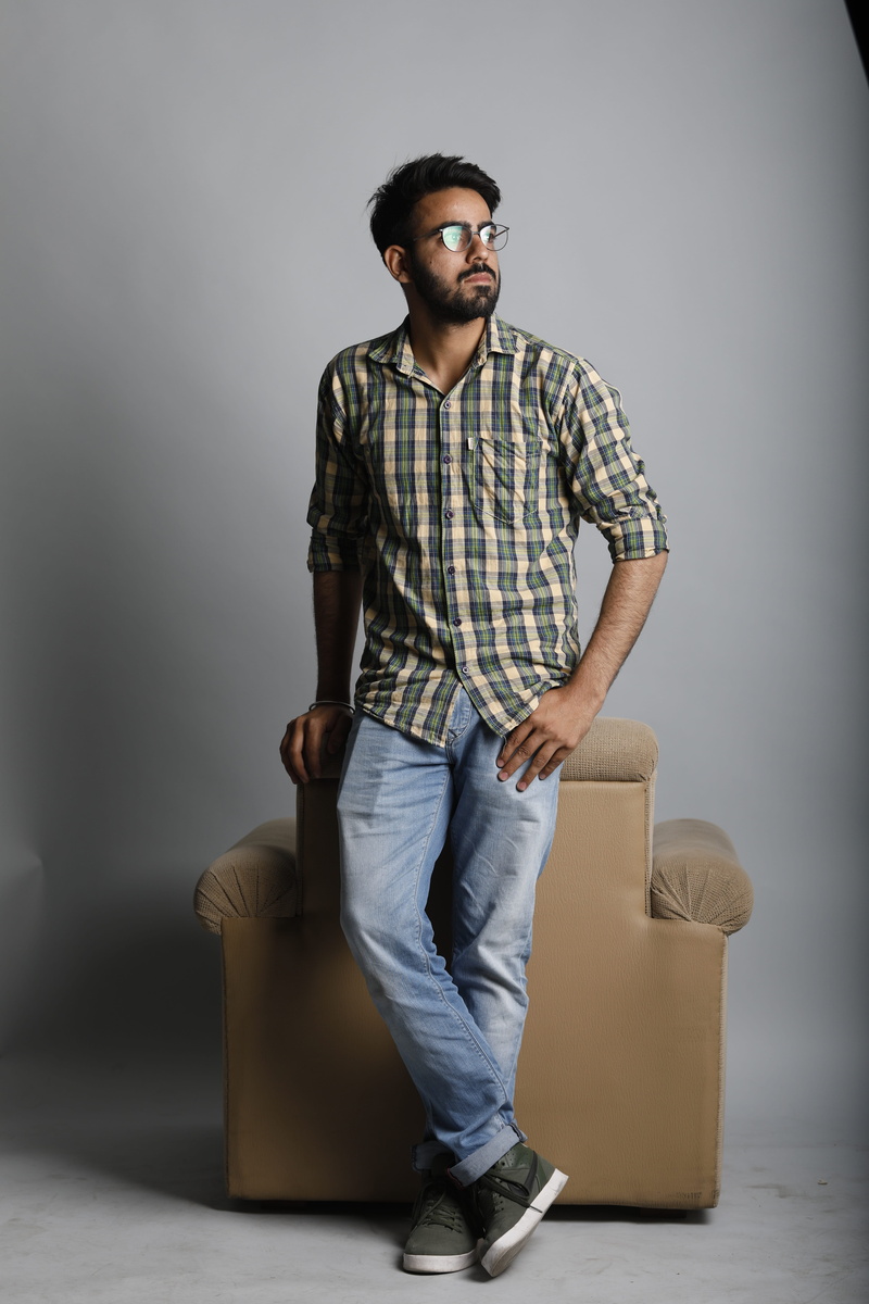 real people, smile, Male, smart, face, office, gray background, young, people, handsome, grey, hair, checked, Person, sitting, smiling, wall - building feature