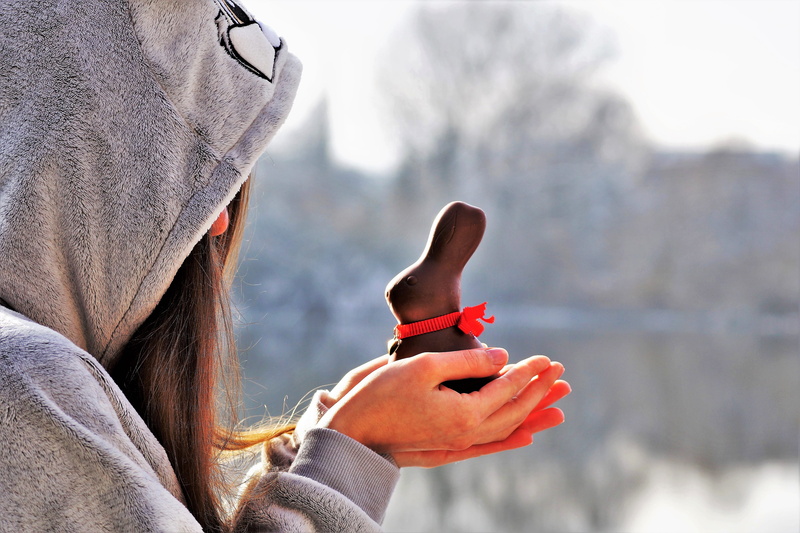 focus on foreground, lifestyles, hood, winter, bunny girl, human body part, portrait, the tradition of, girl, human hand, men, warm clothing, day, hare