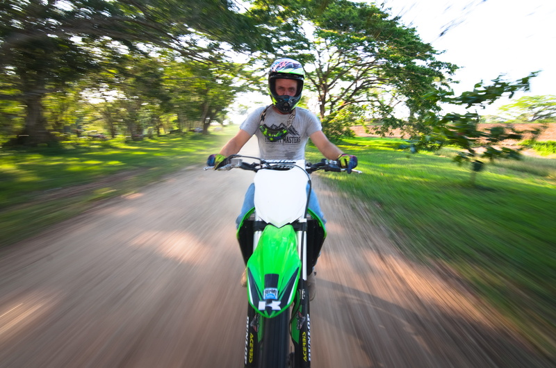 recreation sport, motorsport, road, mode of transportation, tree, ride, motion, kawasaki, 5K, leisure activity, portrait, young adult, front view, bicycle