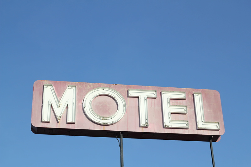 advertisement, lighting equipment, day, hotel, motel, blue background, clear sky, communication, low angle view, old, tourism, 5K, blue, illuminated, signboard