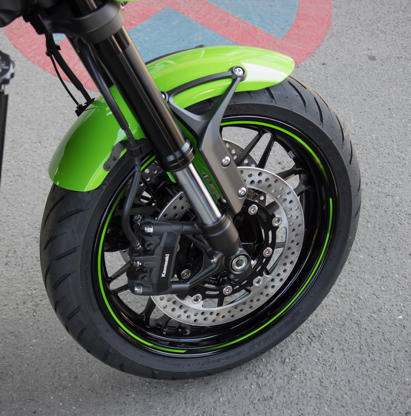 no people, wheel, mode of transportation, green color, front wheel, 4K, suspension, motorcycle, close-up, technology, road, street, still life, city, metal