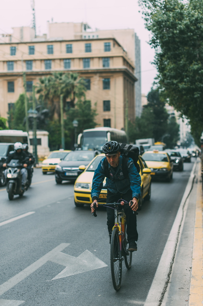 cycling, 2K, building exterior, built structure, road, biking, bike, motorcycle, tree, riding, one person, man, road marking, cars, bicycle, travel, motor vehicle