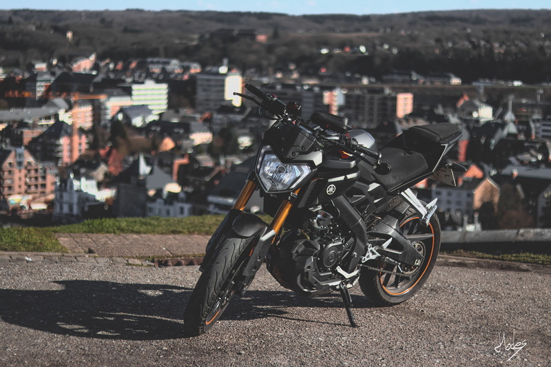 built structure, residential district, stationary, building, building exterior, motorcycle, day, Yamaha, cityscape, city, focus on foreground, land vehicle