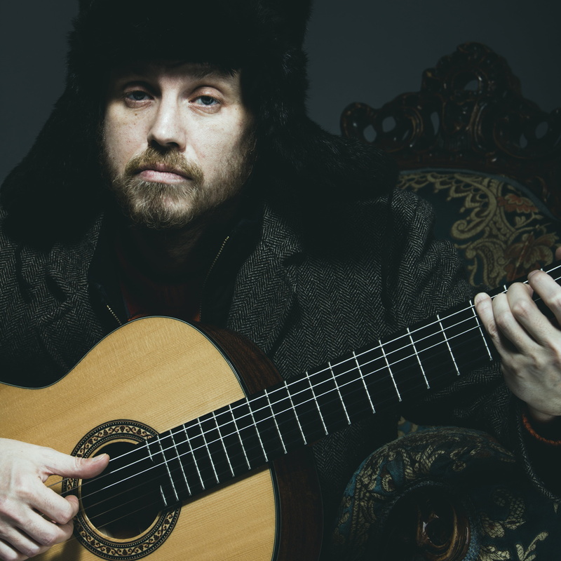 lifestyles, ushanka, people, bizarre, musical equipment, artist, music, playing, one Person, strange, oblique, arts culture and entertainment, plucking an instrument