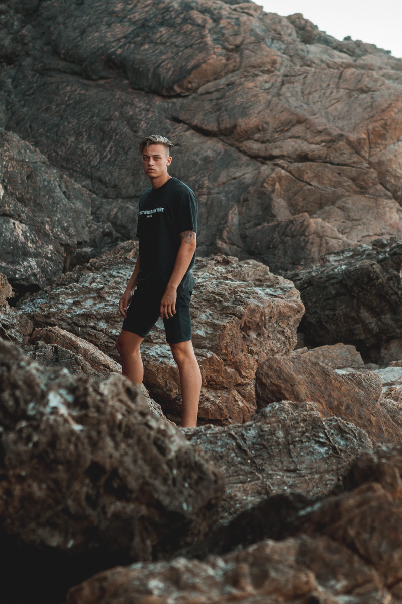 day, land, climbing, portrait, rock formation, male, women, young women, beach, lifestyles, one person, rocks, real people, solid, nature, standing, casual clothing