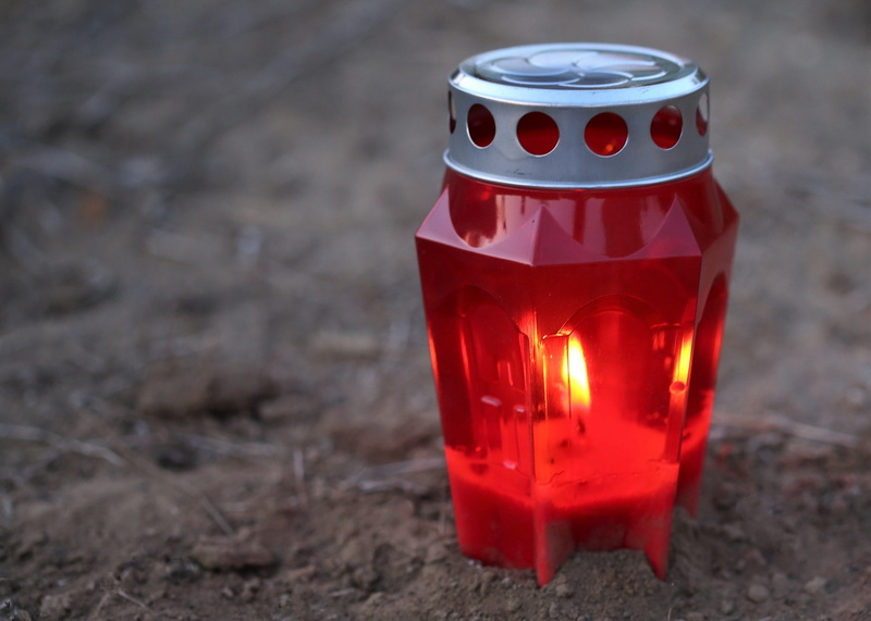 fire, single object, earth, decoration, close-up, heat - temperature, humble, land, grave, remembering, still life, condolence, outdoor, candle, glass - material