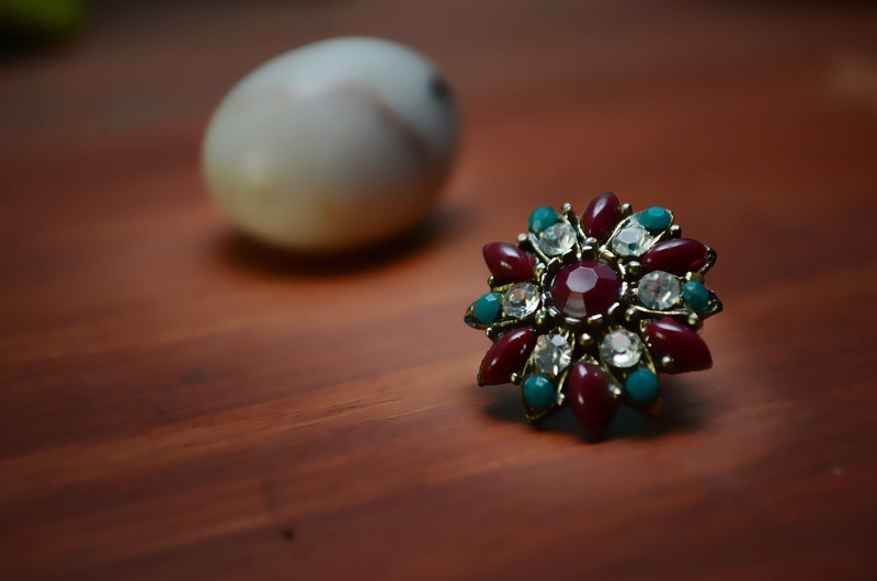 focus on foreground, no people, indoors, treasure, close-up, sparkle, high angle view, crystal, multi colored, rhinestones, selective focus, stone, meditation