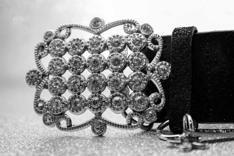 leather, necklace, bracelet, black, pearl jewelry, belts, 5K, no people, metal, still life, belt buckle, sparkling stones, indoors, studio shot, elegance