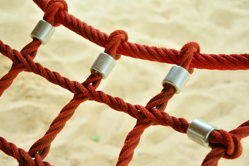 metal, focus on foreground, close-up, security, connection, water, network, climbing net, land, day, braid, sea, protection, outdoors, red, no people, strength