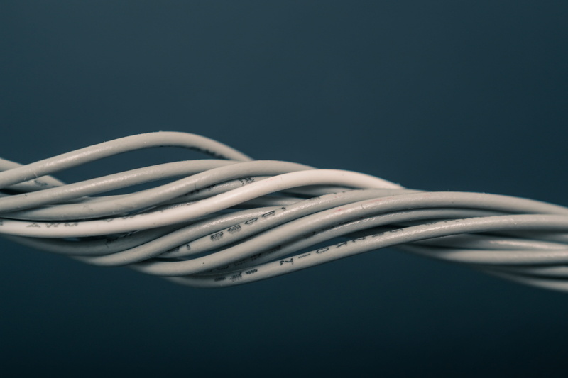 wireless technology, studio shot, close-up, communication, electronics, data, intertwined, black background, computer, blue background, cable, industry