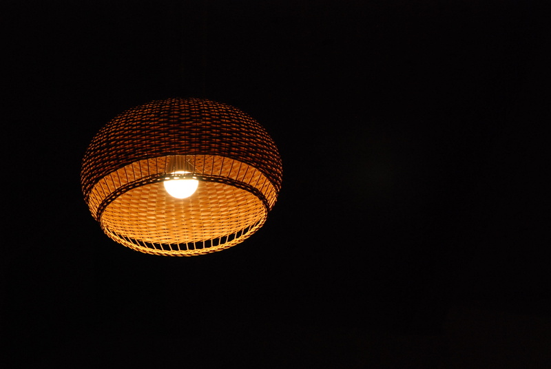 low angle view, lamp, light - natural phenomenon, negative space, light bulb, black background, ceiling, night, electric lamp, technology, studio shot