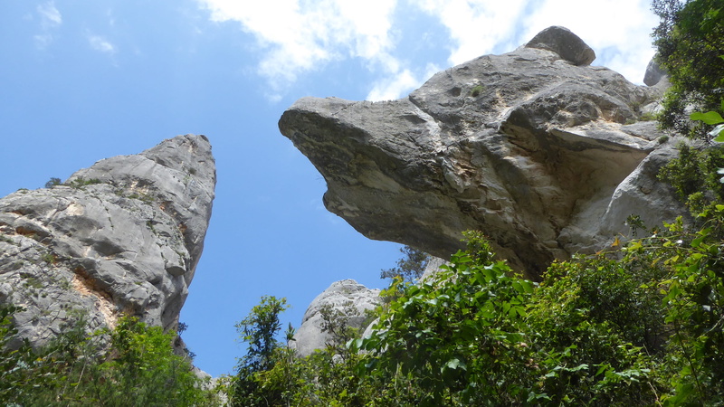 mountain peak, sky, eroded, formation, cliff, beauty in nature, day, tree, rock - object, geology, no people, low angle view, mountain, solid, nature, sardegna