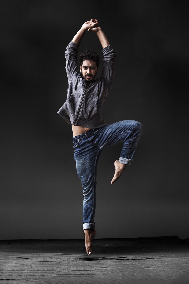 ballet dancer, one person, contemporary art, front view, indoors, beautiful woman, human arm, balance, portrait, casual clothing, 4K, exercise, yoga, black background