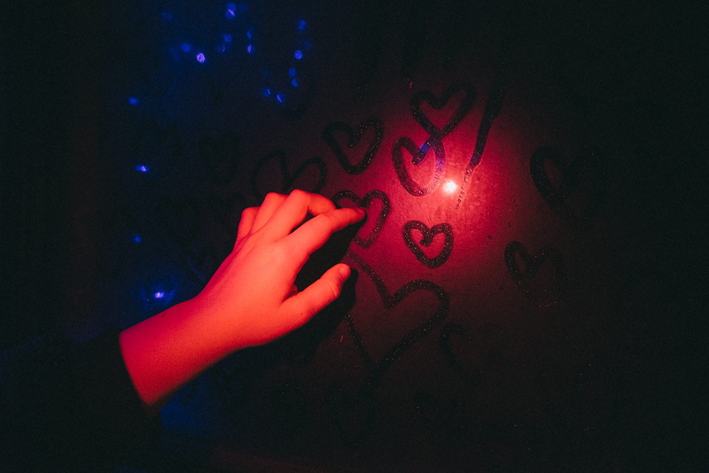 leisure activities, human limb, touching, finger, indoors, arcade game machine, human finger, night, dark, mystery, person, 5K, illuminated, sign, one person