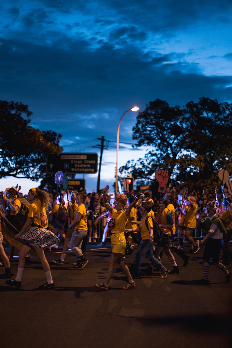 wearing, performance, leisure activity, arts culture and entertainment, audience, festival, dance, apparel, performer, yellow, footwear, stage, real people