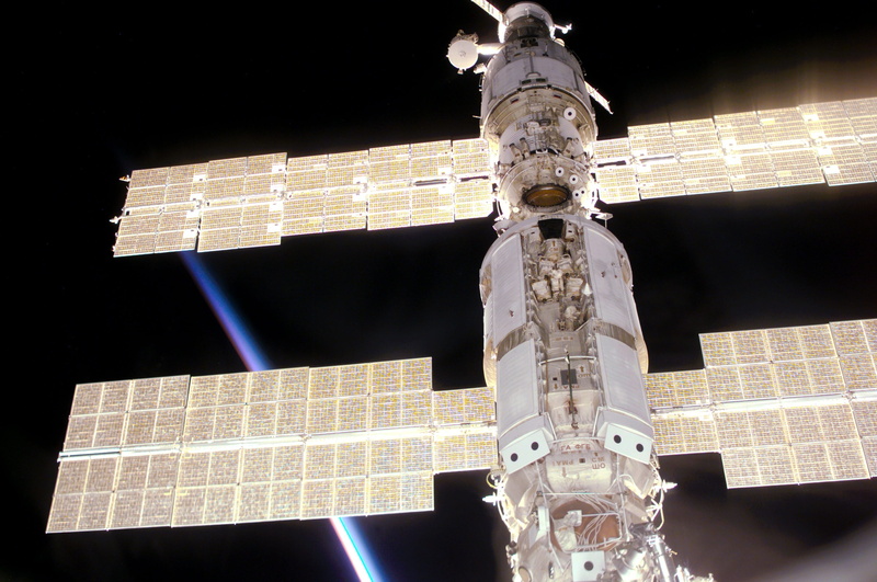 built structure, city, outdoors, human representation, space station, religion, supply vehicle, belief, cross, sculpture, spirituality, travel, service module