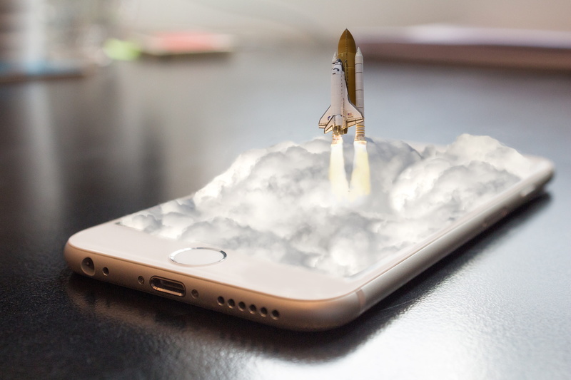 human, indoors, phone, computer, rocket, technology, writing instrument, enlightenment, table, connection, colorful, pen, wireless technology, smart phone