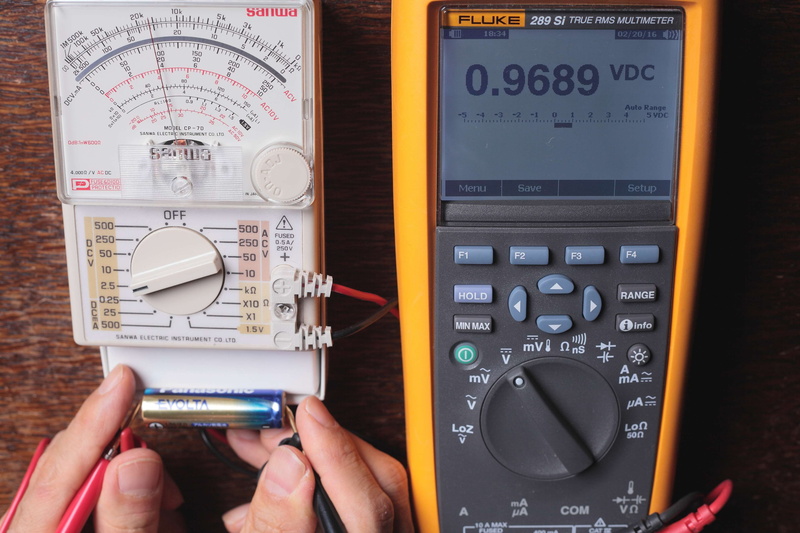 holding, text, voltage, analog, indoors, human hand, battery, finger, tester, number, digit, close-up, accuracy, measurering, measure, lcd, high angle view
