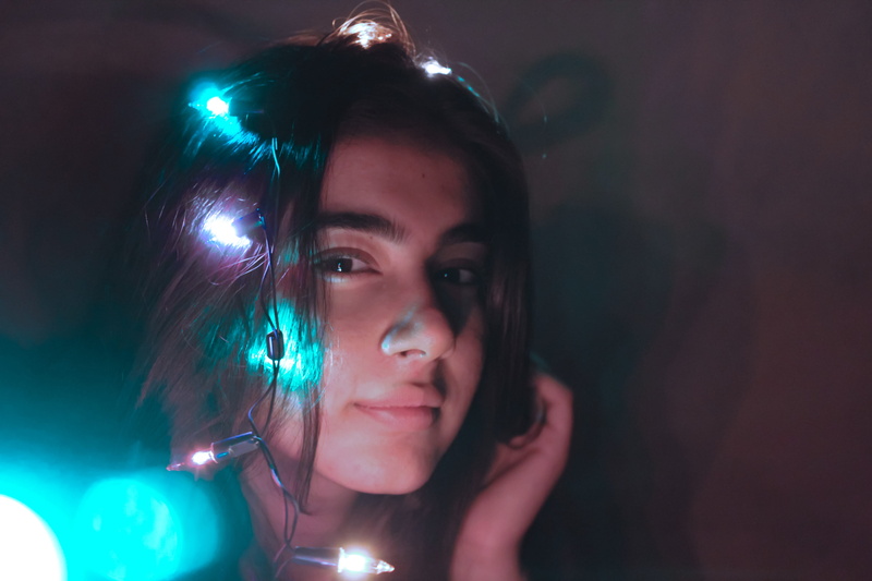 playful, colours, fun, leisure activity, background, close-up, illuminated, girl, nightlife, dim, light, hair, nightclub, headshot, woman, adult, one person