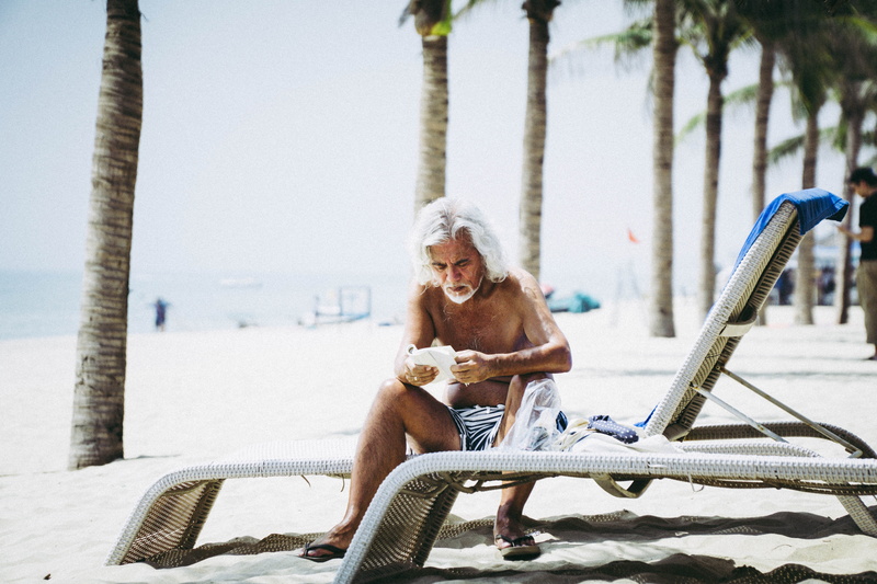 person, holiday, smiling, tropical climate, relaxation, gray, chaise, beach, day, old man, study, water, nature, senior adult, learn, man, sat, reading