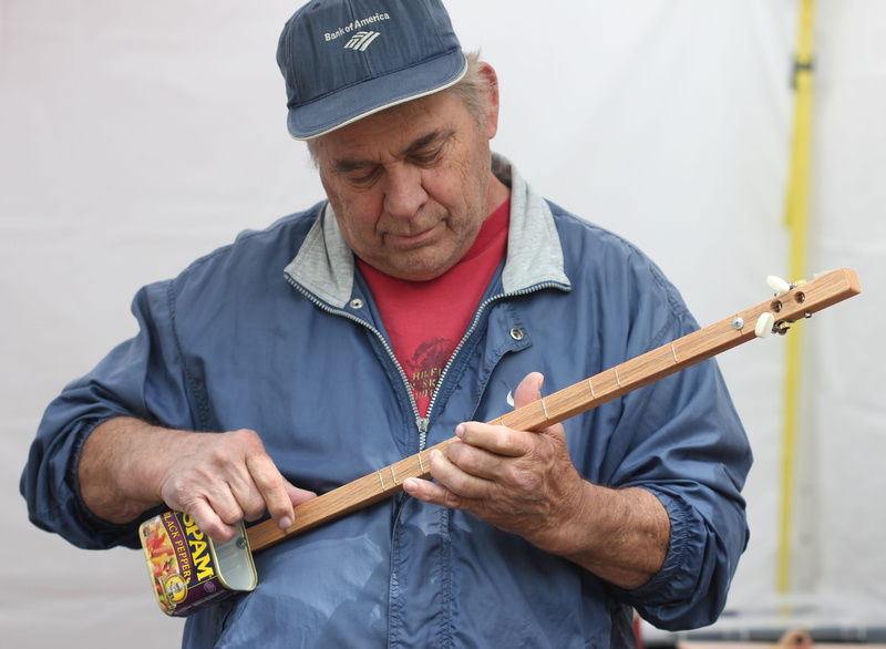 men, strings, instrument, musical, recycled, day, one person, guitar, casual clothing, real people, senior men, males, holding, play, cap, musical instrument