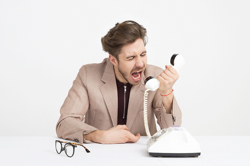 communication, sitting, jacket, men, studio shot, shout, mocking, table, screaming, telephone, disappointed, frustrated, using phone, waist up, holding