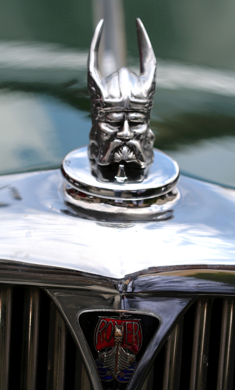 motor vehicle, mode of transportation, close-up, beard, focus on foreground, silver colored, car, chrome, barbarian, metal, vintage, 5K, spain, history