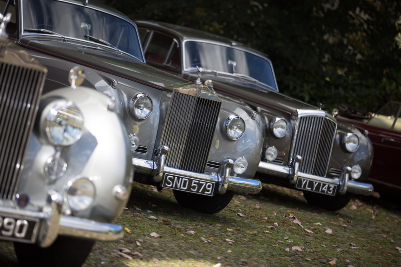 rolls royce, vintage car, motor vehicle, outdoors, close-up, stationary, no people, selective focus, focus on foreground, 5K, spirit of ecstasy, car, retro styled