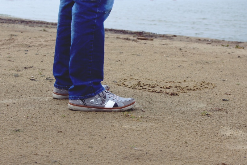 one person, coast, sea, stand, human, grey, rain, sand, live, man, loneliness, jeans, legs, people, shoe, dom, human Leg, low section, wellness, lonely