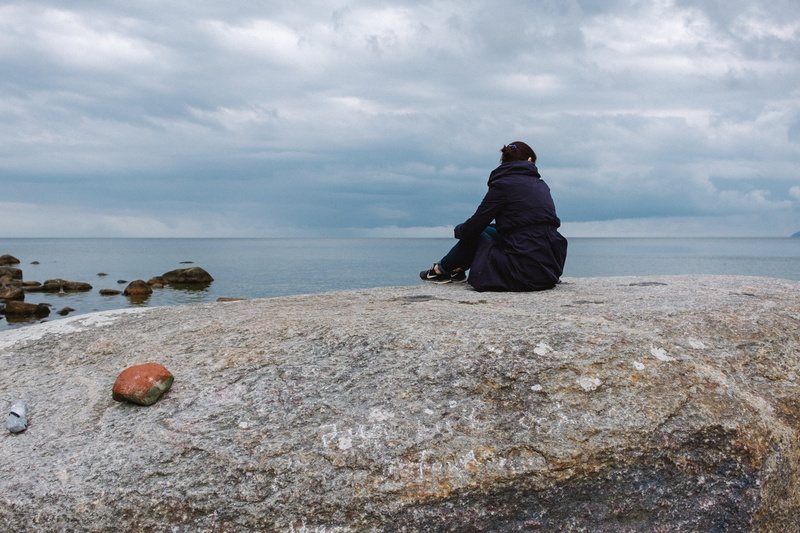 relaxation, one person, europe, nature, outdoors, relax, mountain, sitting, young, horizon, baltic, dom, lifestyle, water, rock, people, blue, stone, female