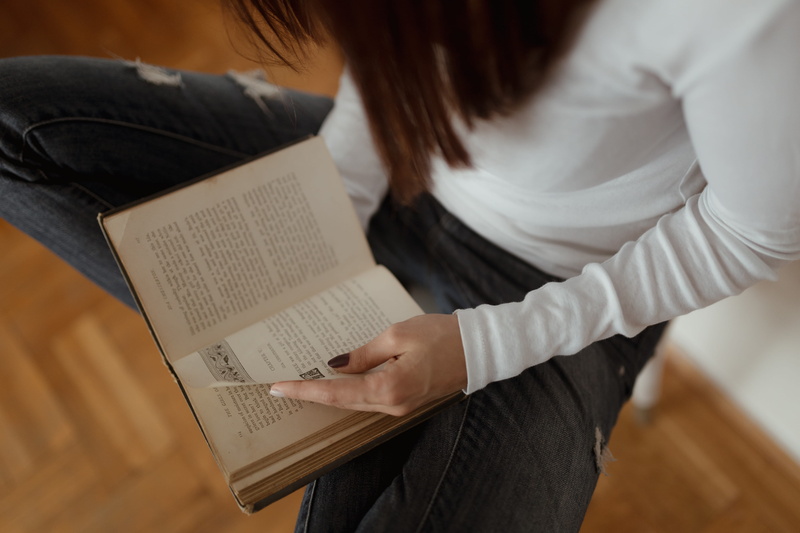 publication, beautiful, young, jeans, holding, activity, sitting, indoors, communication, relaxing, caucasian, learning, reading, education, girl, woman