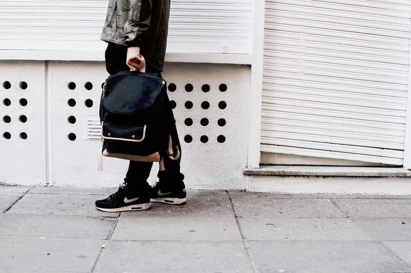wall, black, jacket, iron, architecture, man, people, built structure, bag, holding, nike, 1080P, guy, outdoors, wall - building feature, real people