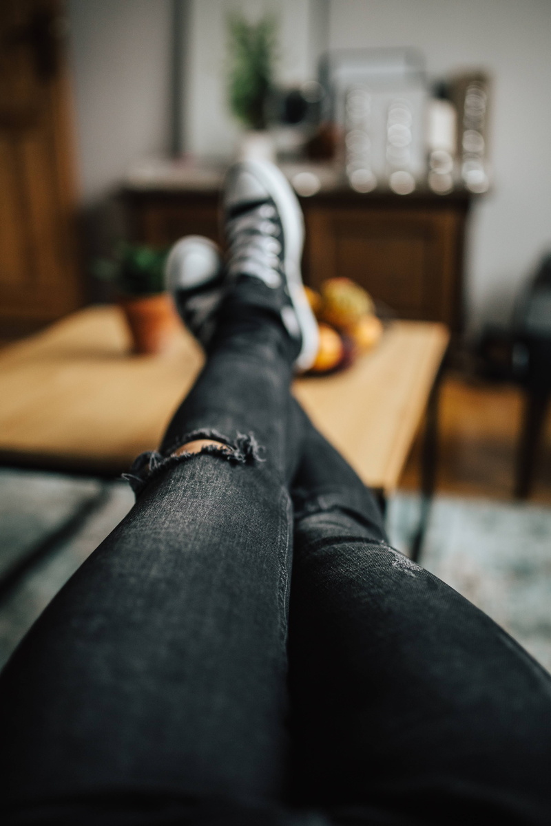 lifestyles, furniture, home interior, laptop, bed, all star, shoe, body part, Apple, human limb, human Leg, table, black, indoors, one person, women, low section