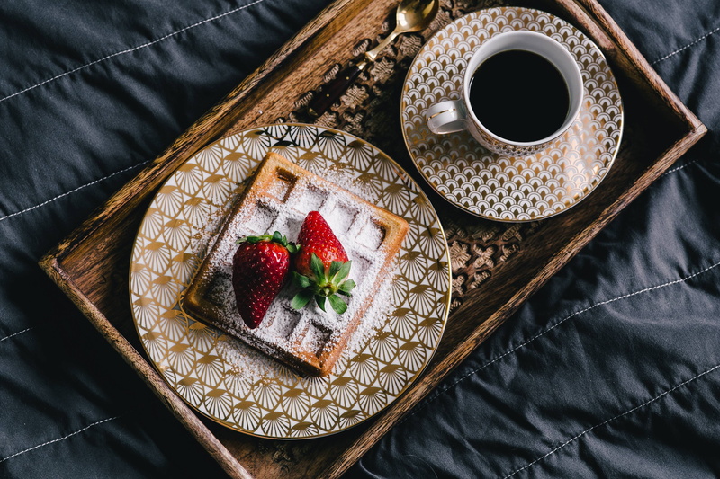 strawberries, wooden tray, berry fruit, waffle, sweet food, powder, food and drink, baked pastry item, healthy eating, golden plate, high angle view, tray