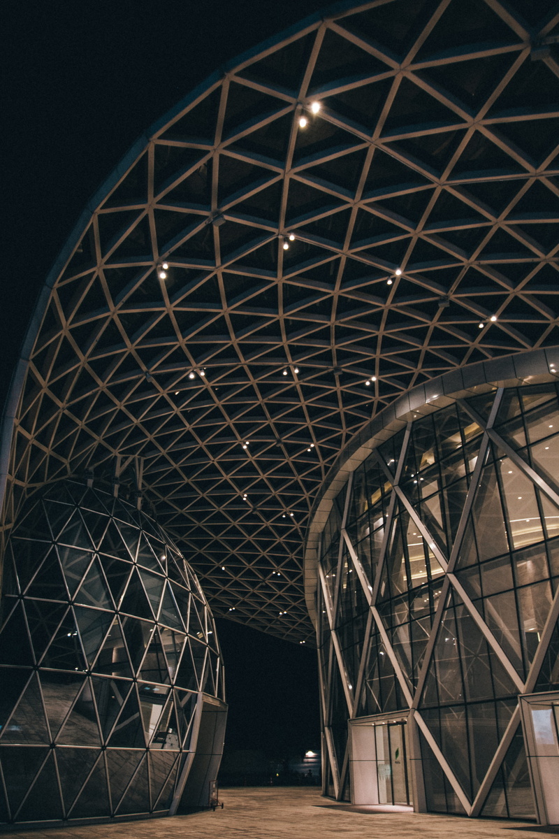 building, illuminated, architecture, art, roof, symmetry, geometric shape, window, triangle, close, shape, convention center, housing, reflection, gray