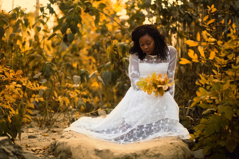 rock, flower, front view, daylight, standing, white, wearing, plant, beautiful, bride, model, garden, bouquet, wedding, wedding dress, pose, color, person