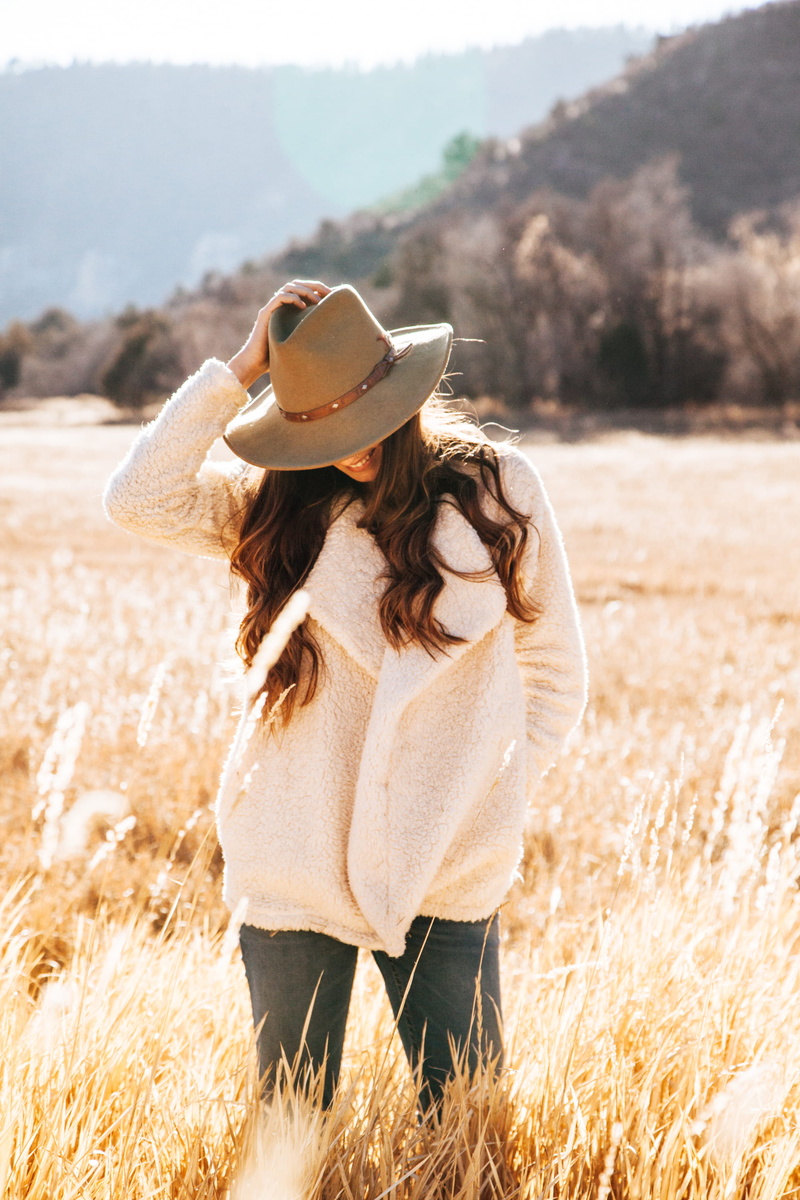 leisure activity, photoshoot, hair, lifestyle, hat, happy, field, fashion, brown hair, warm, plant, long hair, countryside, nature, person, women, clothing