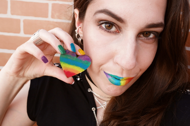 portrait, decor, holding, young adult, rainbow colors, love, headshot, looking at camera, beautiful woman, heart, human body part, hairstyle, close-up